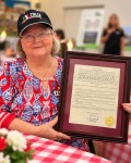 2026-10-18 -Alba Rettinger Founder Displays City Council Resolution -03